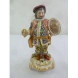A porcelain figurine of a gentleman in period costume, gold anchor mark