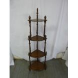 A mahogany four tier Whatnot with turned baluster columns