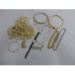 A quantity of costume jewellery to include necklaces, pendants, brooches and a wristwatch