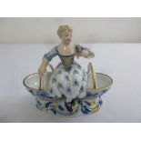 Meissen a19th century onion skin pattern salt in the form of a lady flanked by two baskets, A/F
