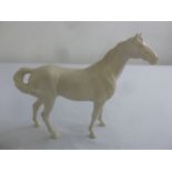 A Beswick blanc de chine figurine of a horse