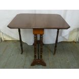 A Victorian mahogany Pembroke table, rectangular on turned cylindrical legs and supports