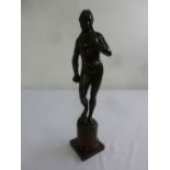 A 19th century bronze figurine of a Grecian goddess holding a snake on raised marble base, 53cm (h)