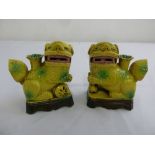 A pair of Chinese yellow ground porcelain Dogs of Foe