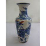 A Chinese 19th century vase decorated with scenes of courtiers and family scenes