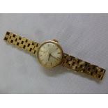 An Omega 9ct gold ladies wristwatch on a 9ct gold bracelet, approx total weight 19.3g