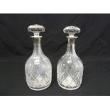 Mappin and Webb a pair of cut glass decanters with drop stoppers and silver collars