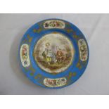 A 19th century Sevres style cabinet plate decorated with figures in a woodland setting