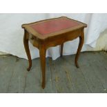 A mahogany rectangular side table with inlaid leather top and two drawers on cabriole legs