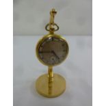 Swiss gold plated open face pocket watch on stand inscribed S. S. M. Smart 15/19 K.R. Hussars