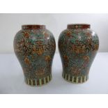 A pair of Chinese Republic period baluster vases, brown ground decorated with flowers, leaves and