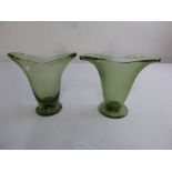 A pair of Whitefriars green glass vases on circular spreading bases