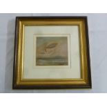 A framed and glazed French watercolour of an airship floating above a lake with a boat in the