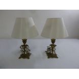 A pair of Art Nouveau style gilded metal table lamps with crystal drops