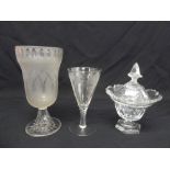 A Regency cut glass covered bowl, a Victorian etched glass vase and wine glass etched with grapes