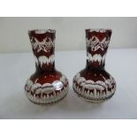 A pair of early 20th century Bohemian ruby overlaid glass vases