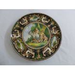 An Italian Faenza charger decorated with classical scenes, A/F