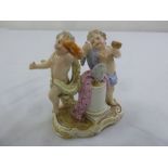 Meissen figural group of putti depicting music and the arts, marks to the base