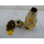 Three Steiff animals, Hedgehog Joggi 1670/40, Lamb Snucki 1520/11 and Penguin 2507/20, all with