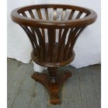 Mahogany campagna form plant stand with pierced slat sides on triform base
