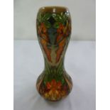 Moorcroft bulbous vase decorated with stylised flame lilies, marks to the base, 29cm (h)