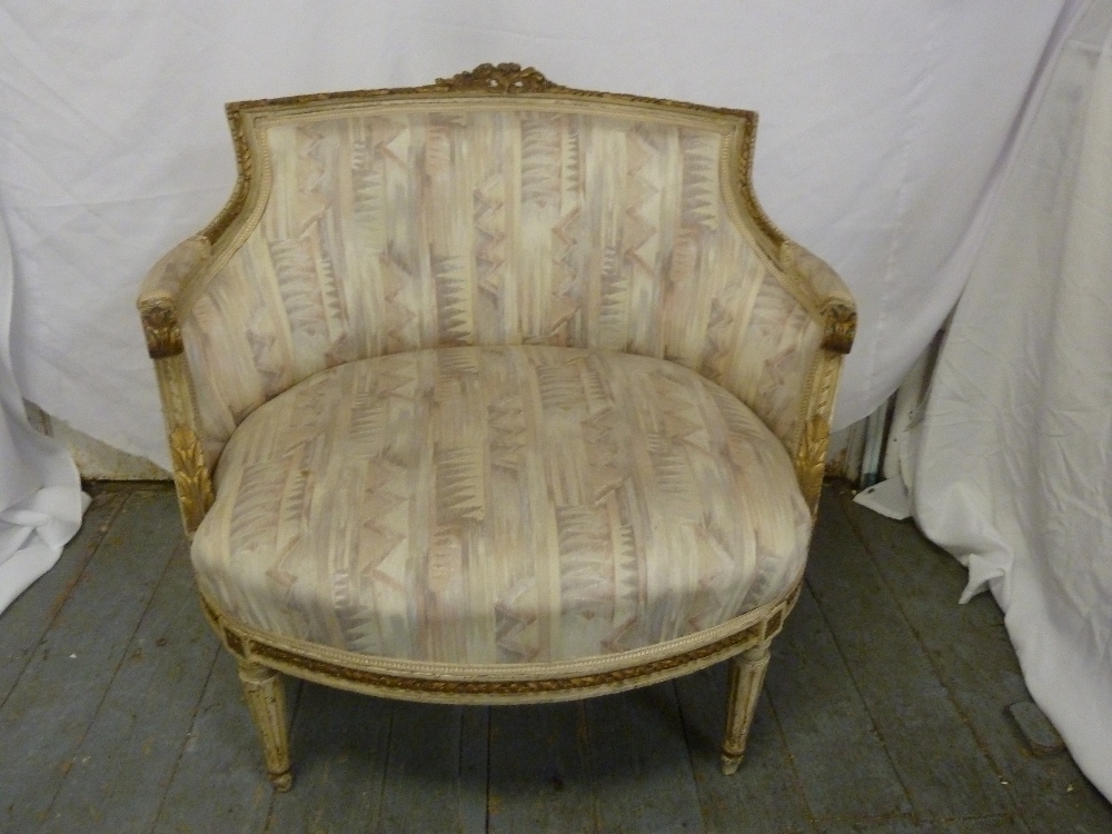 A French 19th century salon chair on four turned tapering legs