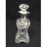 A late Victorian cut glass decanter with drop stopper and silver collar, London 1899 and a silver