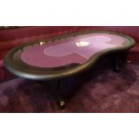 A shaped rectangular bespoke poker table with purple baize and black leatherette surround on