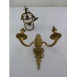 An early 20th century gilt metal and cut glass hall light and a two branch gilt metal wall light