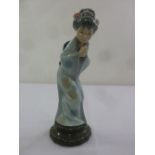 Lladro figurine of a Geisha on raised circular plinth