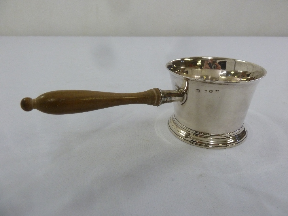 A George II silver brandy warming bowl with wooden handle on circular base, London 1758