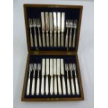 A cased set of silver hallmarked dessert eaters for twelve persons, Sheffield 1921, A/F