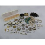 A quantity of costume jewellery to include necklaces, brooches, rings and watches