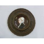 KPM style hand painted porcelain plate of St Elizabeth of Hungary mounted in a bronze frame