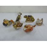 Royal Crown Derby six figurines of birds and a chameleon figurine, all with gold seals