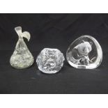 Mats Jonasson glass paperweight etched with a panda and two other Scandinavian glass paperweights