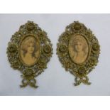 A pair of gilt metal decorative photograph frames
