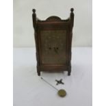 An early 20th century oak cased mantle clock two train movement, to include key and pendulum