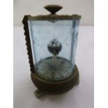 An automaton desk clock in the form of an aquarium with etched glass and metal base and mounts