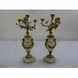 A pair of French 19th century gilt metal and marble candelabra on shaped marble bases