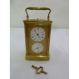 A brass repeating carriage clock with barometer to include key