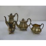 A Victorian matched silver four piece teaset, pear shaped engraved with flowers, leaves and scrolls,
