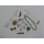 A quantity of costume jewellery to include necklaces, brooches, earrings and rings
