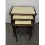 A mahogany nest of three tables on cabriole legs