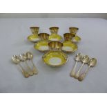 A set of six Doulton silver plated and porcelain egg cups and spoons