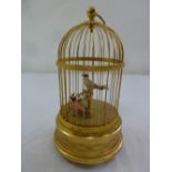 Swiss Automation two singing birds in a gilded metal cage with circular carrying handle on three