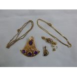 A quantity of 9ct gold jewellery to include a pendant, brooches and chains, approx total weight 17.