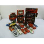 A quantity of large scale diecast cars to include Burago and Maisto, some boxed