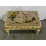 A Victorian rectangular foot stool with a tapestry inset of a man playing a musical instrument to
