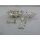 A quantity of silver to include a pierced fruit bowl, a bonbon dish, a pair of tongs, a spoon and
